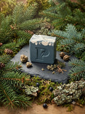 Prudent Preservations artisan bar soap with forest green body and white frost-like swirls at the top, handcrafted cold-process.