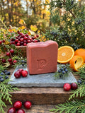 Prudent Preservations artisan bar soap with ruby cranberry and frosted white swirls, handcrafted cold-process.
