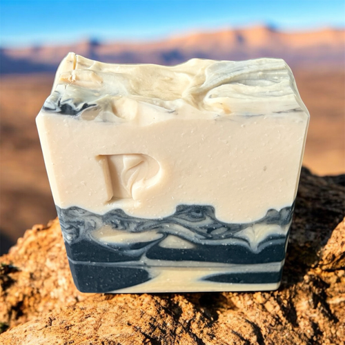 Prudent Preservations Artisan Swirl Bar Soap with embossed P logo, white and charcoal grey marbled design, handcrafted for cleansing and nourishing.
