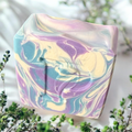 Prudent Preservations artisanal bar soap with swirled lavender, blue, and cream colors. Gentle cleansing and moisturizing.